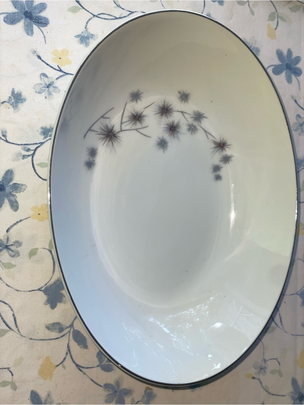 White Porcelain Oval Serving Platter with Gray Floral Starburst Accent